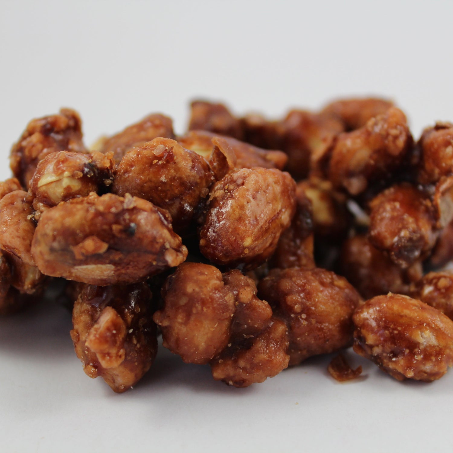 Cluster of roasted or fried nuts on a white background